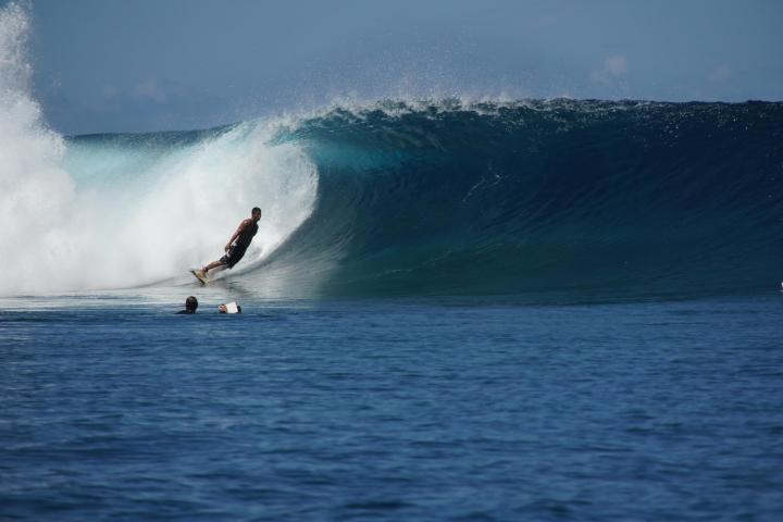 Man surfing in Teahupoo